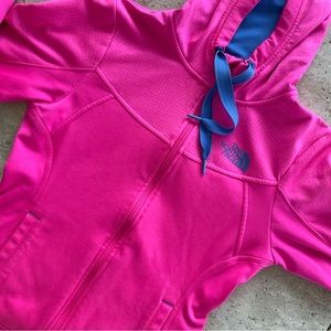 Bright pink north face runner’s jacket
